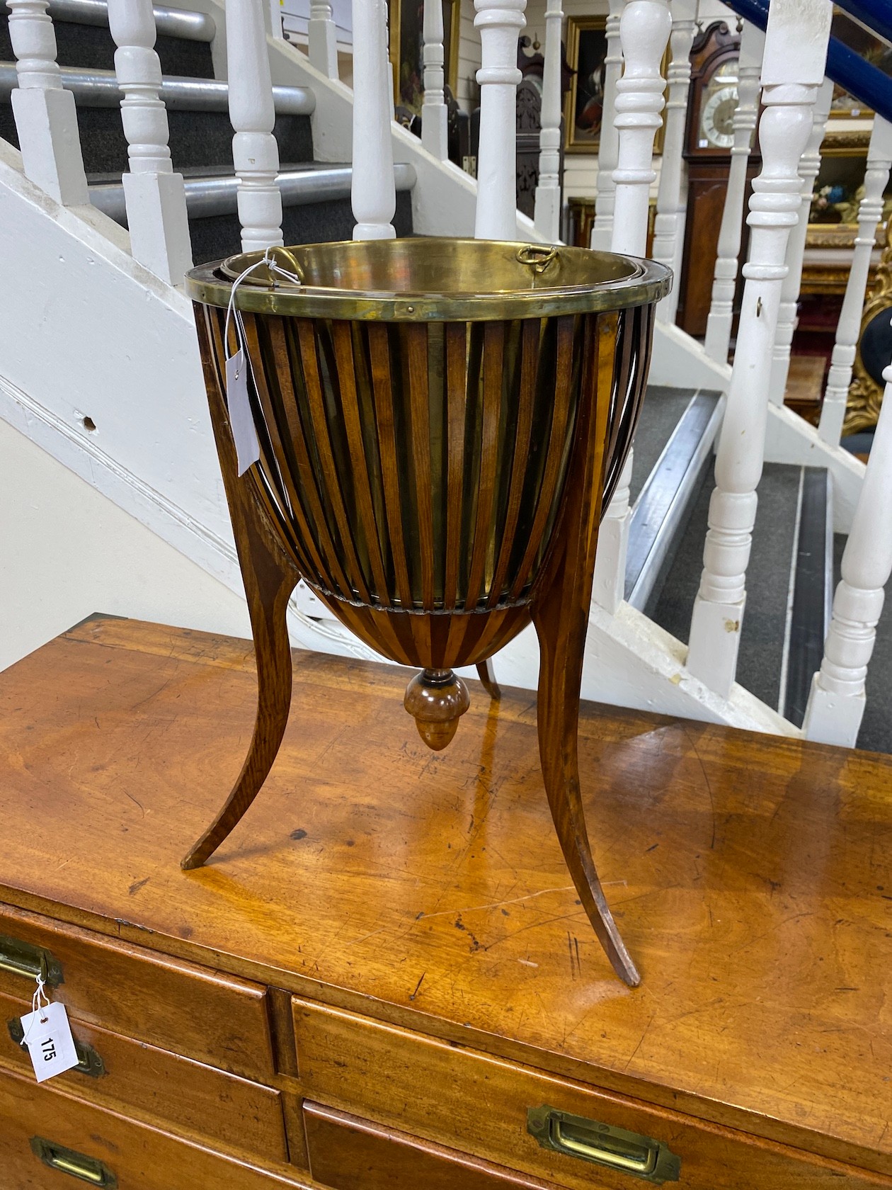 A late 19th / early 20th century Dutch inlaid mahogany jardiniere with brass liner diameter 33cm, height 50cm.